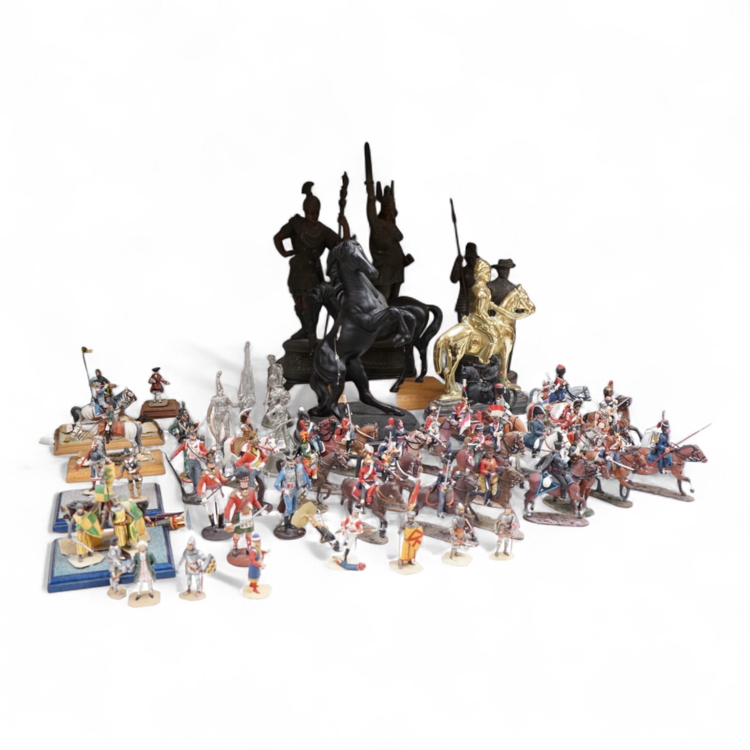 A pair of spelter figures a brass door stop two models of horses two other figures and a large group of toy soldiers. Tallest 45cm.